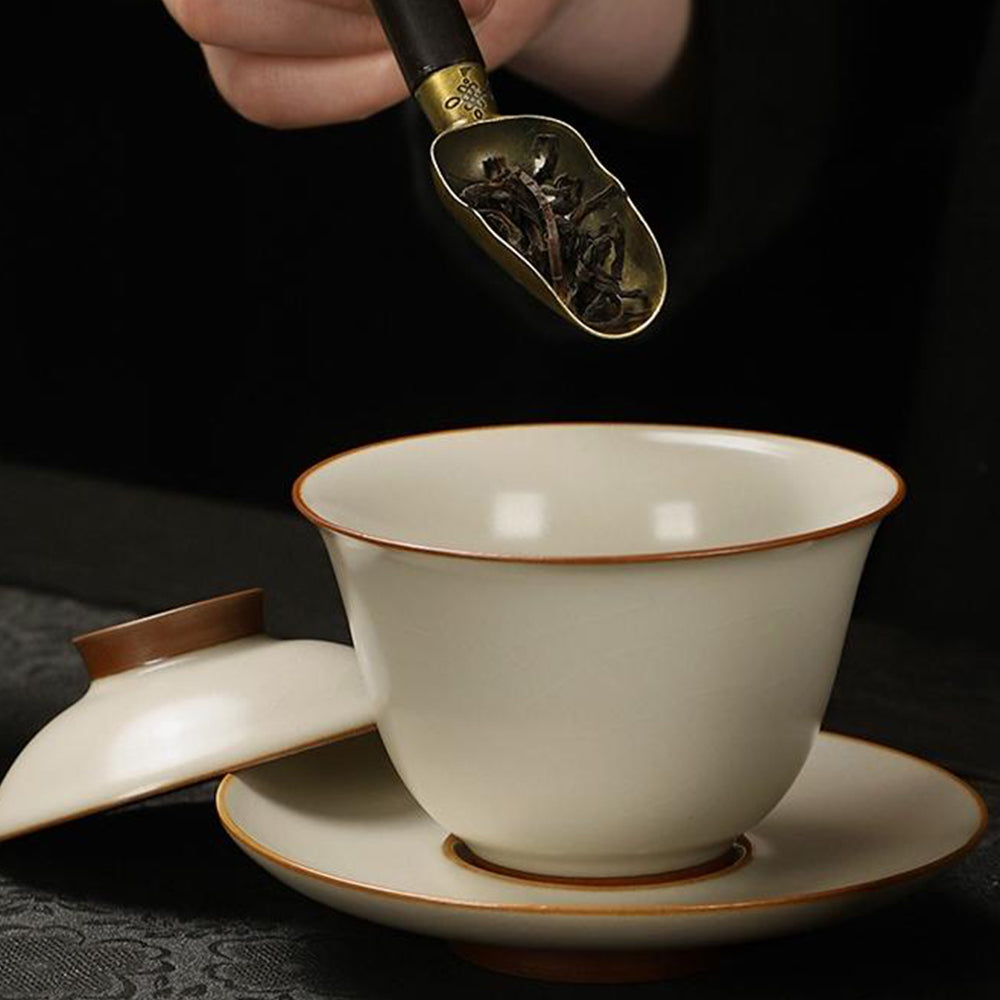 Close-up of yellow Ruyao teapot showcasing smooth glaze and elegant design