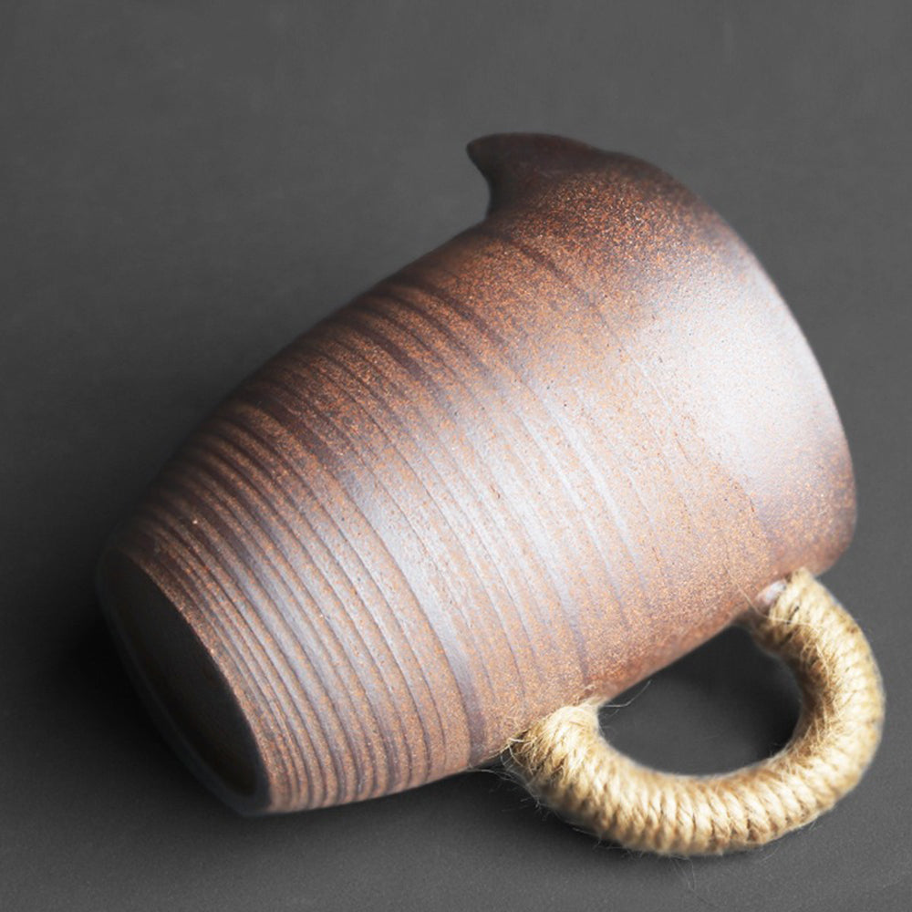 Fair cup being used to pour tea, demonstrating its large capacity and smooth spout.