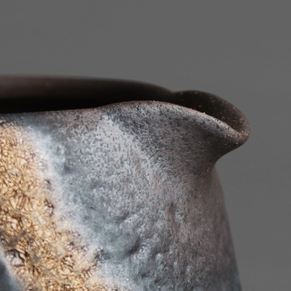 Close-up of Japanese stone texture rock fair cup showing metallic surface