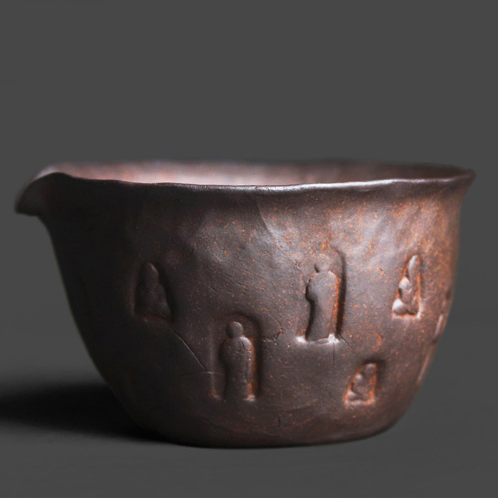 Handcrafted coarse pottery Zen tea cup with Buddha engraving, natural rustic finish