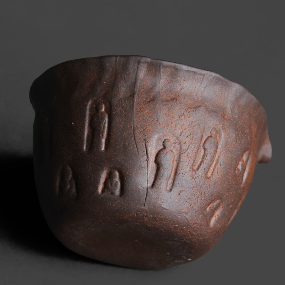 Traditional handcrafted pottery tea cup for brewing and gifts, showing rough texture