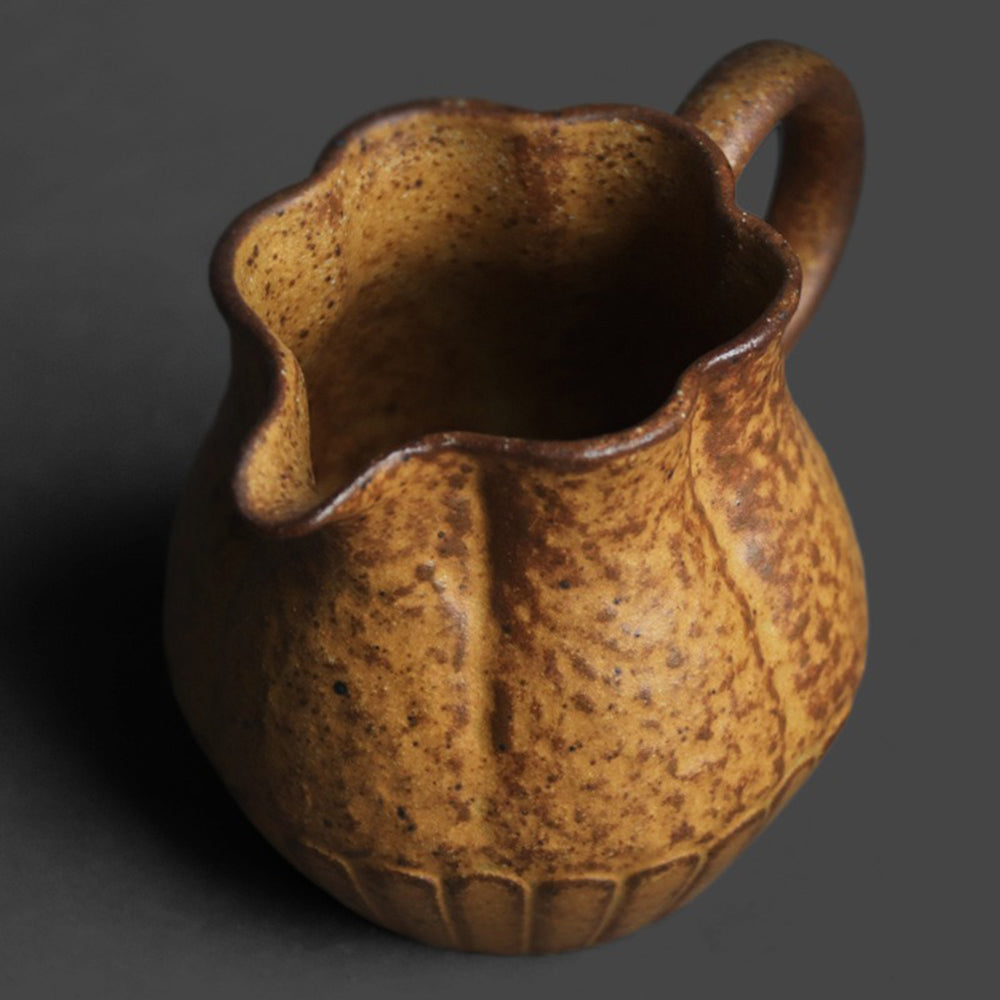 Side profile of ceramic mug highlighting the curved handle and beak-style spout ideal for clean pouring.