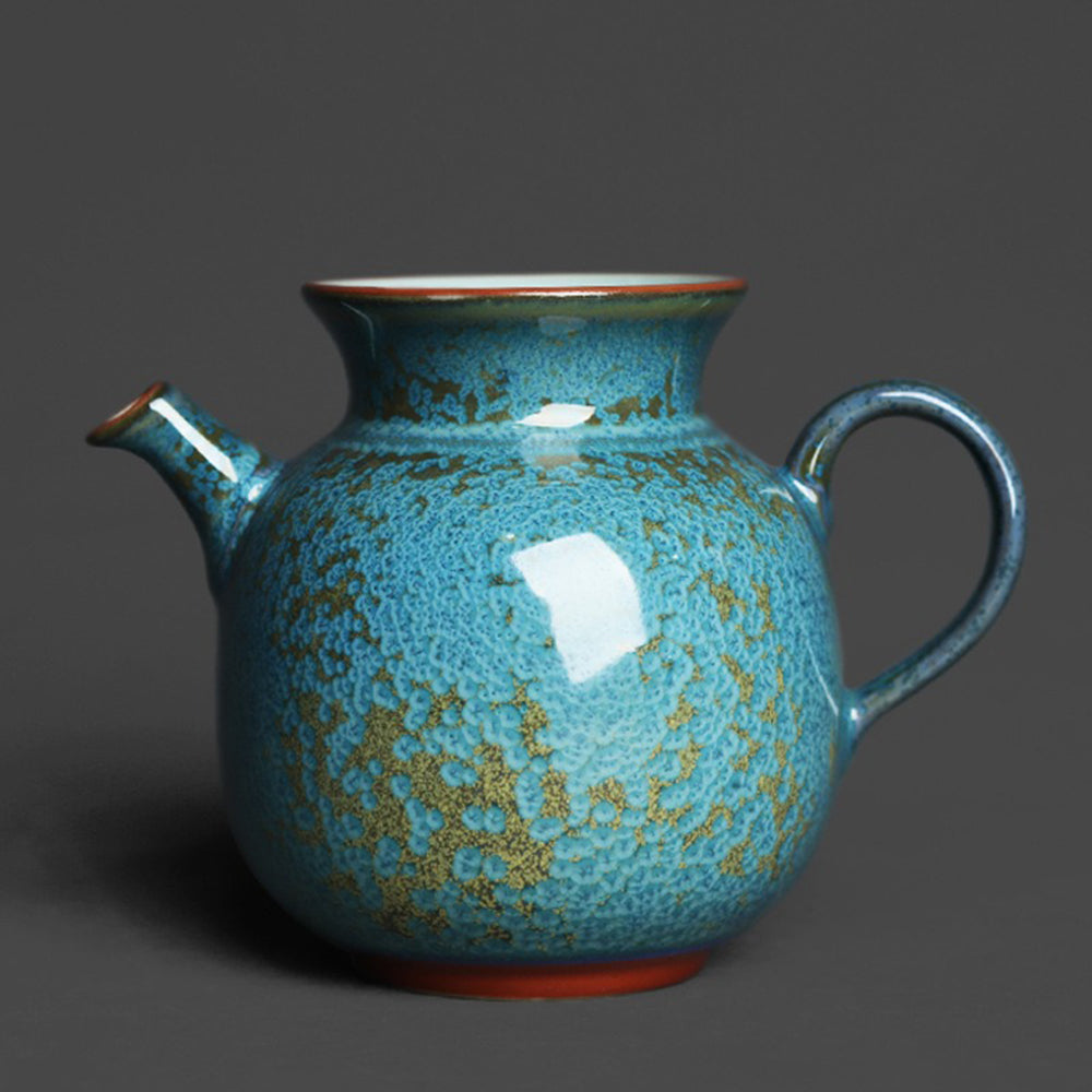 Close-up of the blue jade fair cup showing its mottled glaze and handcrafted details