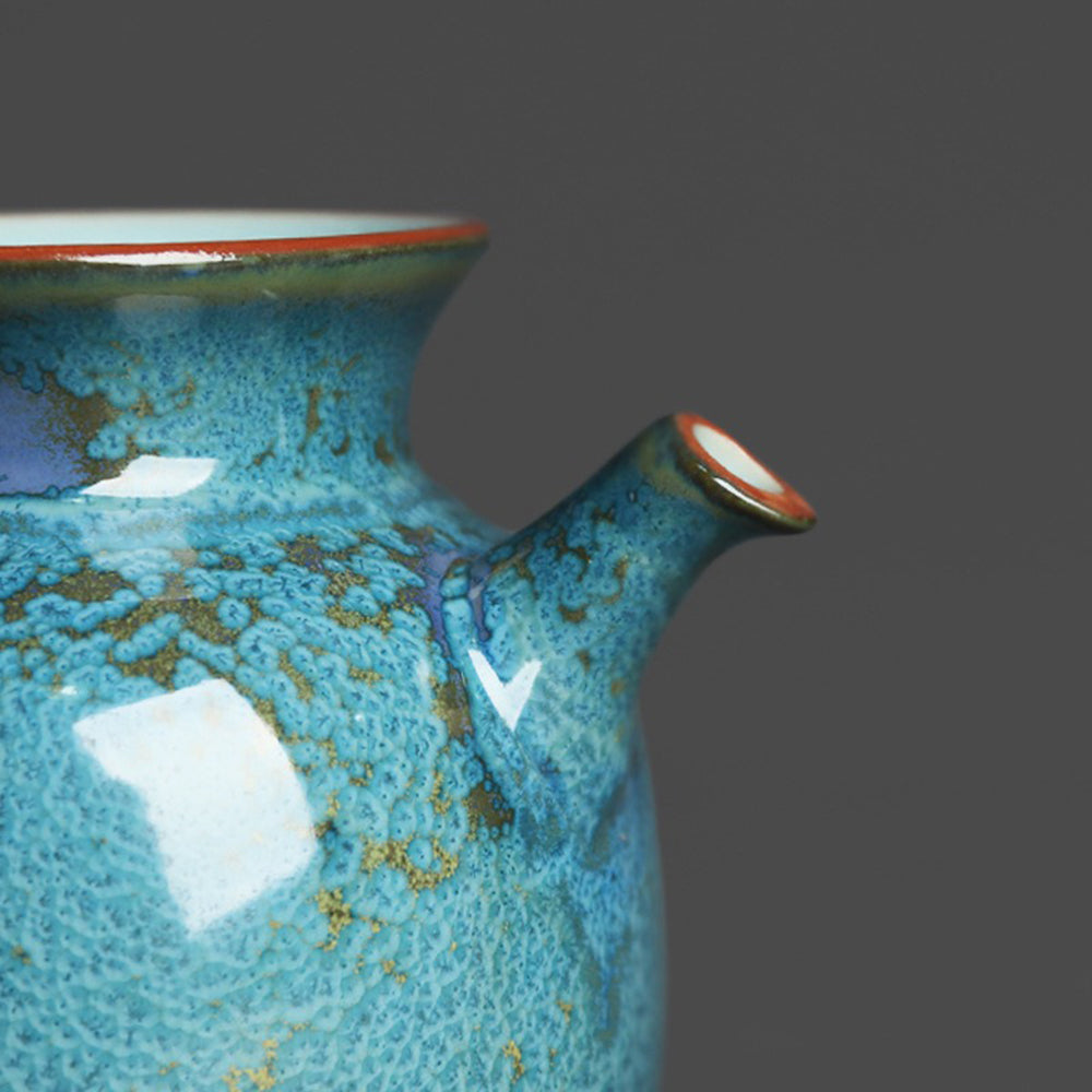 Close-up of the blue jade fair cup showing its mottled glaze and handcrafted details