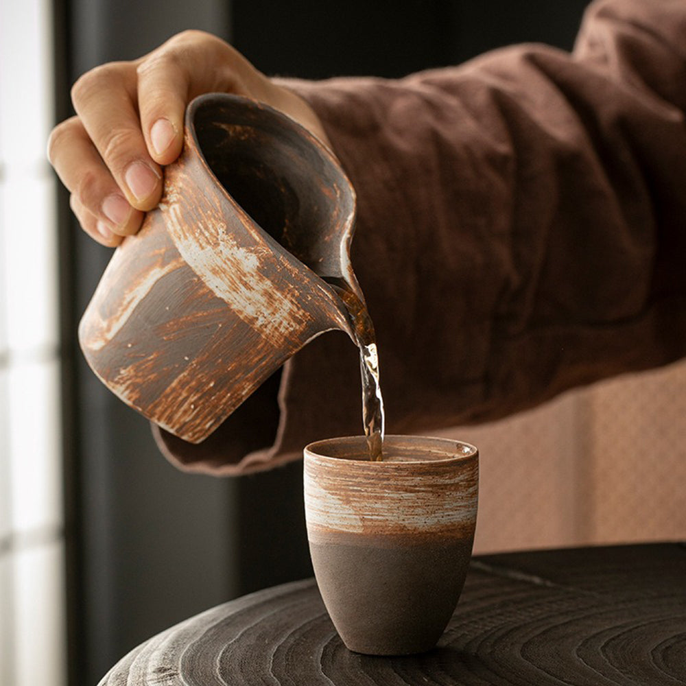 Elegant Japanese tea brewing cup with retro glaze and grainy finish in a cozy setting