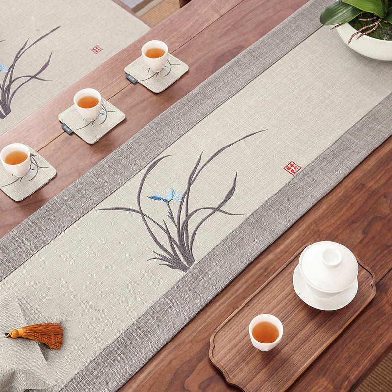 Doris luxury orchid tea mat showcasing vibrant embroidery and smooth texture.