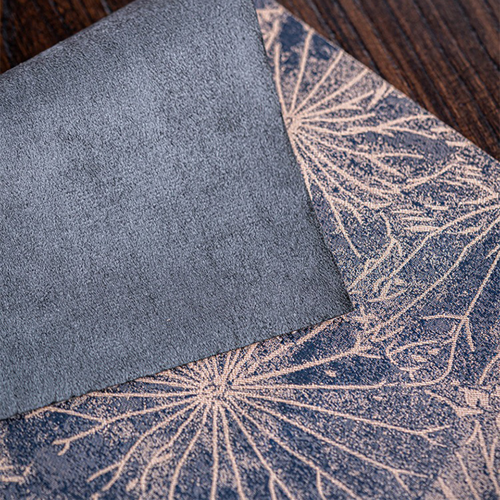 Rolled-up foldable tea table mat showing compact storage capability