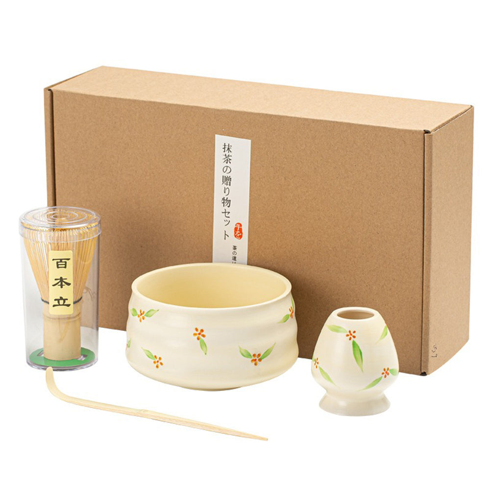 Elegant Japanese matcha tea set featuring a bamboo whisk and ceramic bowl.