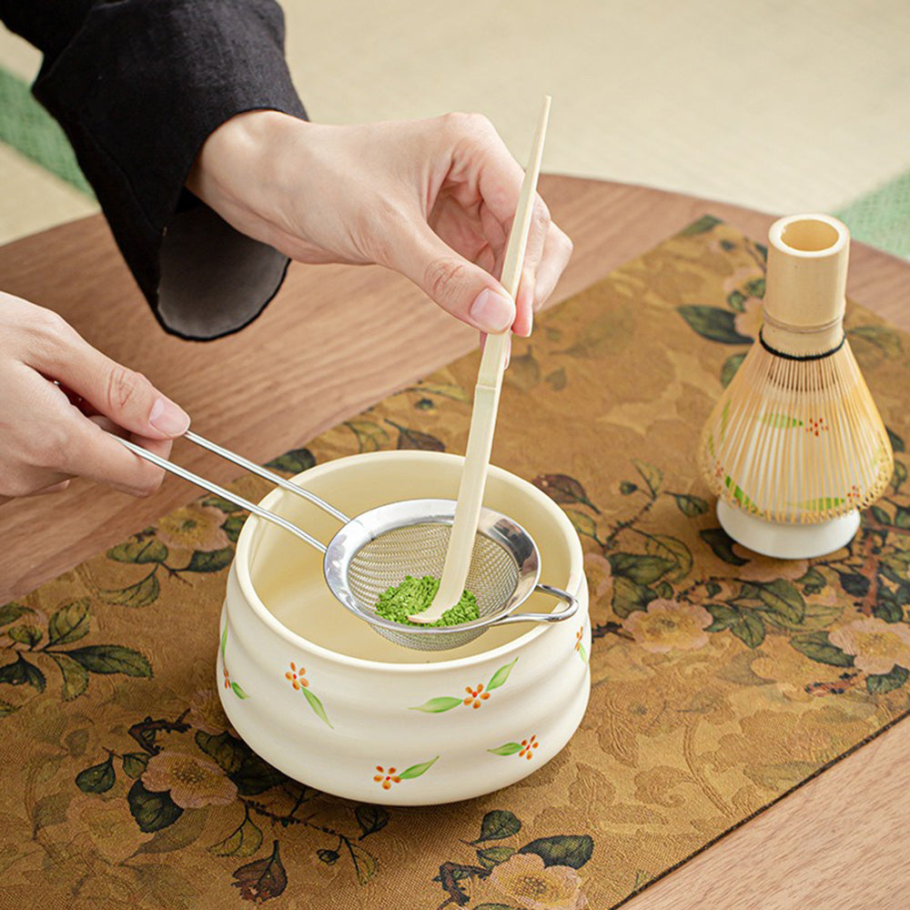 Close-up of the premium ceramic matcha bowl with floral design.