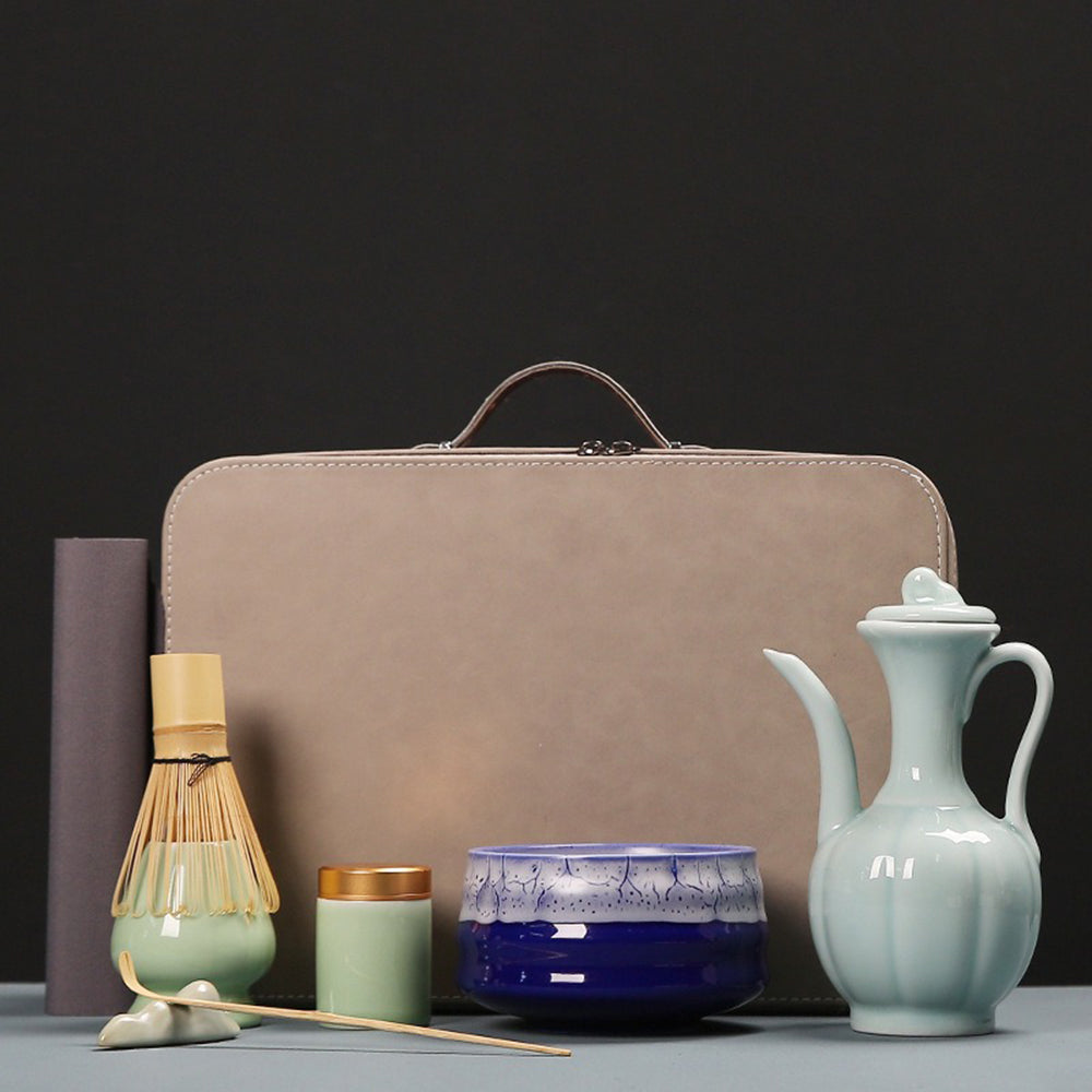 Artisan matcha tea set with travel bag, showcasing ceramic bowl and bamboo whisk.