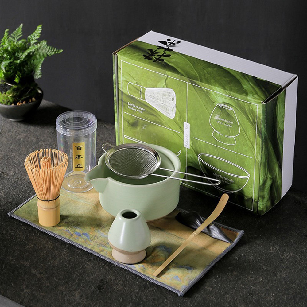 Elegant Japanese matcha bowl with bamboo whisk and accessories, perfect for tea ceremonies.