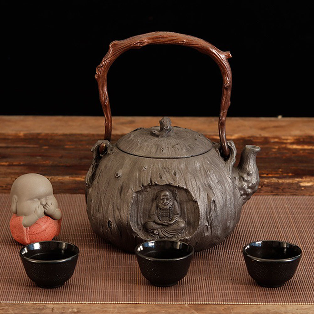 Tea being poured from the cast iron teapot into a cup, highlighting smooth spout and design