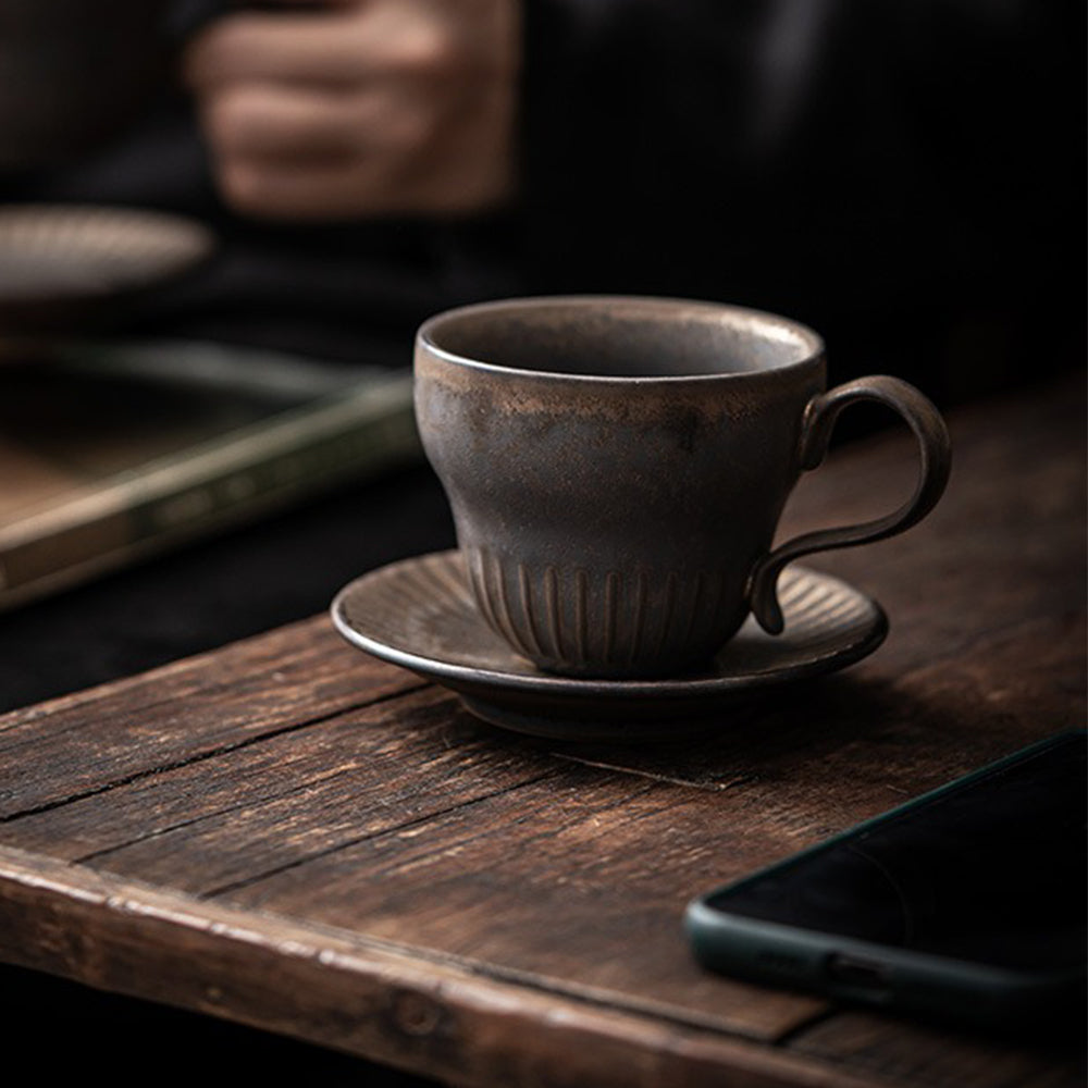 Bizen-yaki tea cup set on a wooden table, perfect for enjoying tea or snacks.