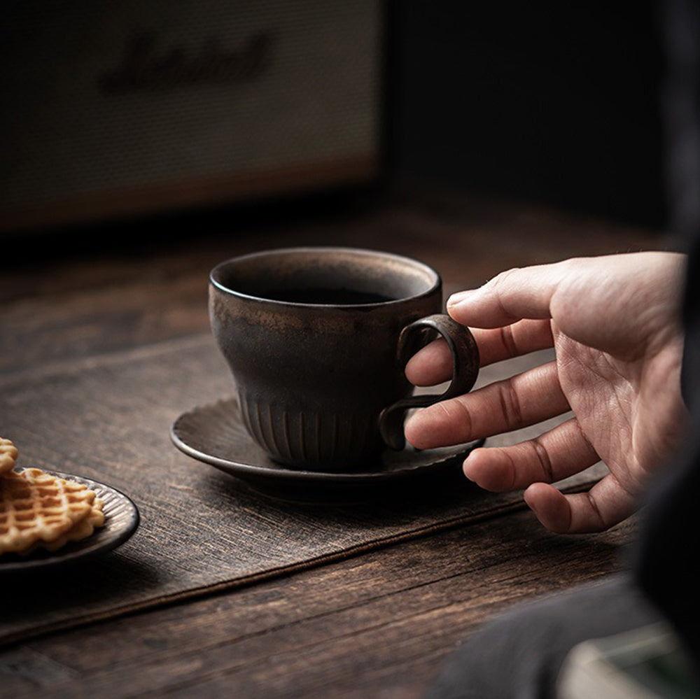 Elegant display of the Bizen-yaki tea cup with saucer, emphasizing its ergonomic handle and craftsmanship.
