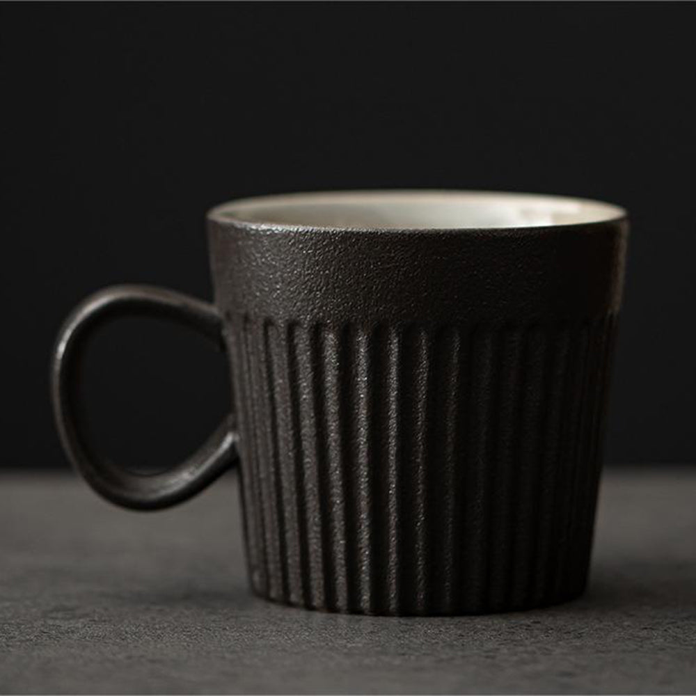 Side view of Hagi-yaki ceramic mug with ergonomic handle, perfect for tea or coffee
