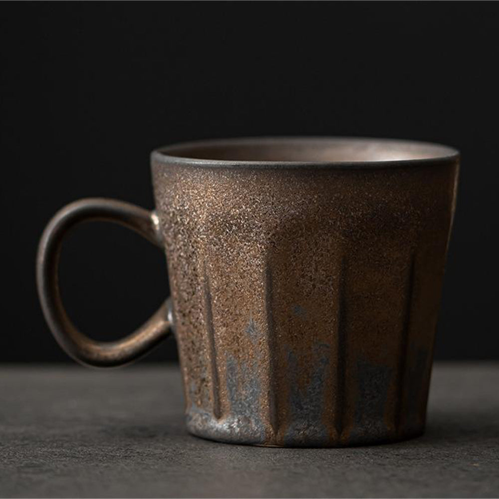 Close-up of handmade Hagi-yaki tea cup showing rustic glaze and traditional Japanese design