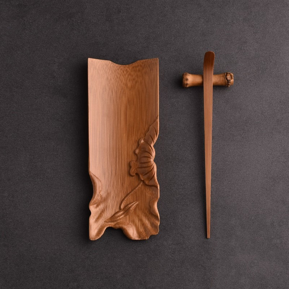 Close-up of tea needle next to the bamboo tea holder on a tea table