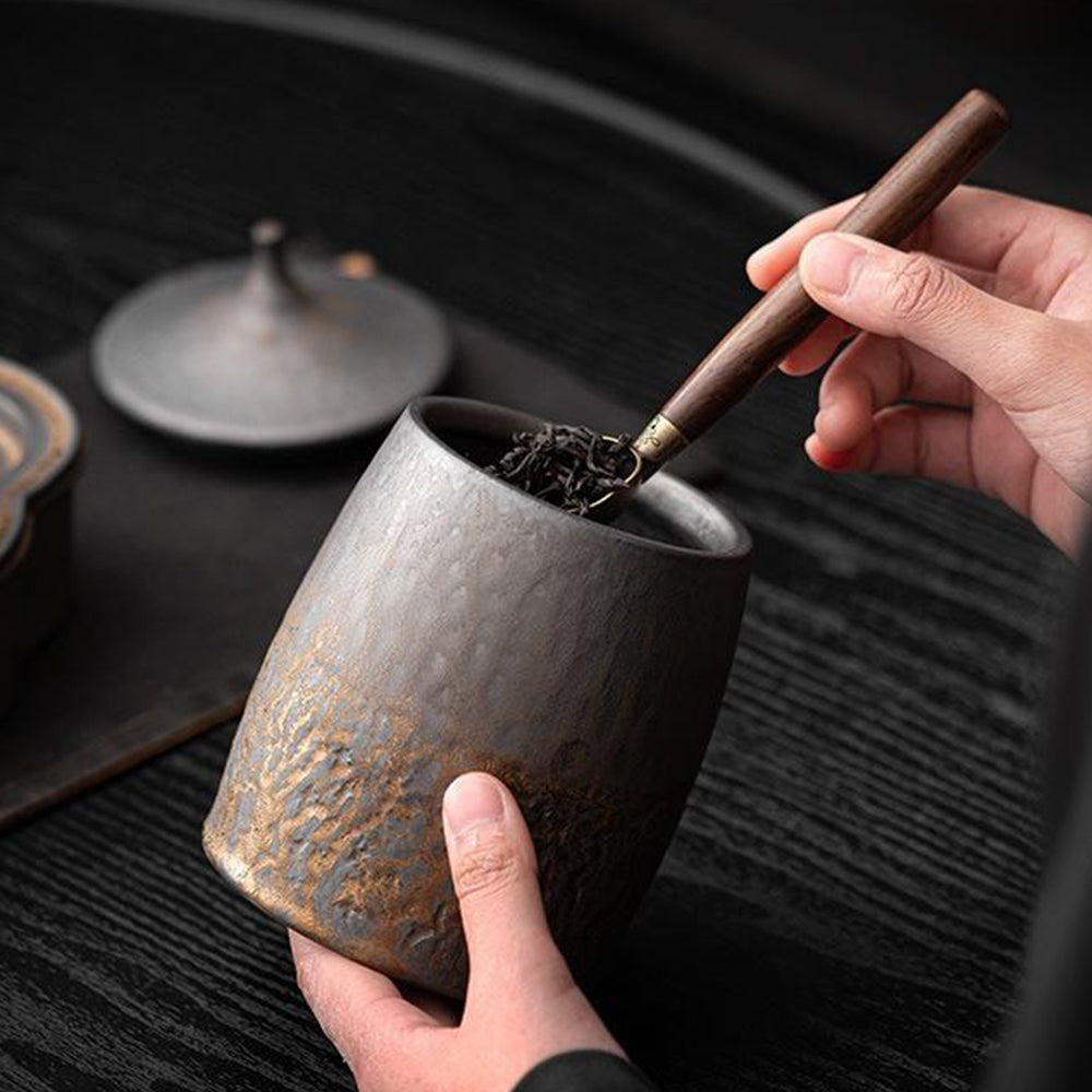 Close-up of the rustic barn tea caddy showcasing its unique metallic texture.