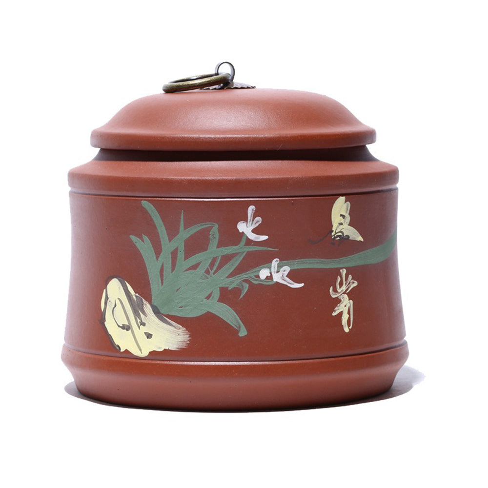Close-up of handmade Yixing purple clay orchid tea caddy showing intricate texture and shape