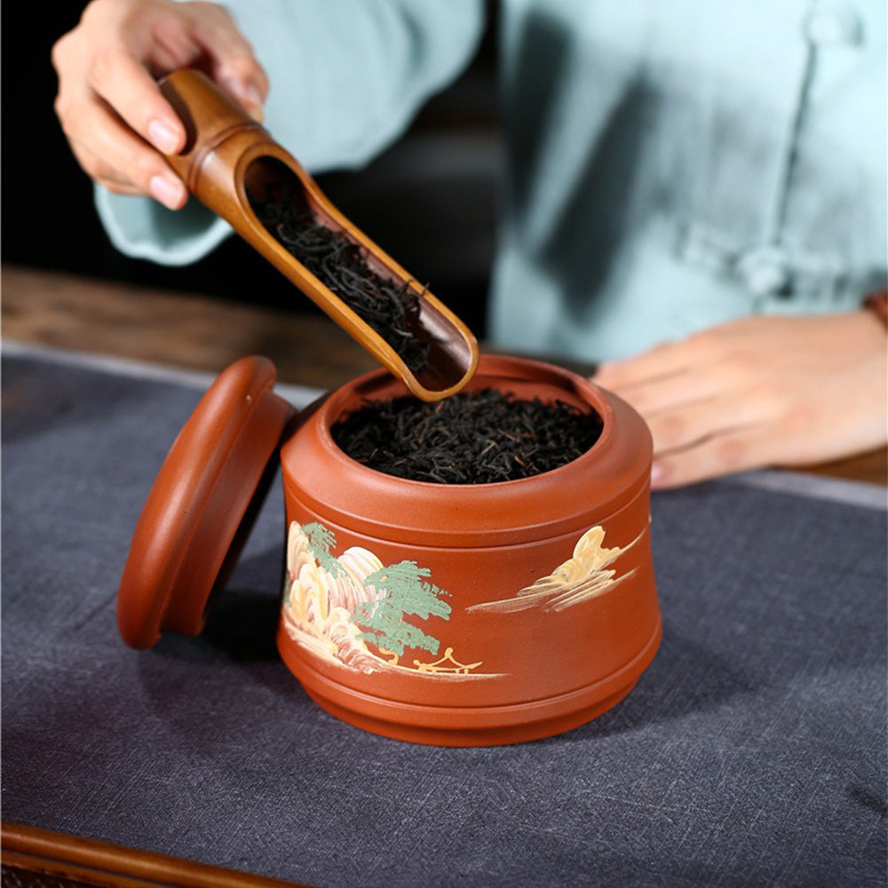 Elegant purple clay tea caddy on a tea table, highlighting traditional craftsmanship