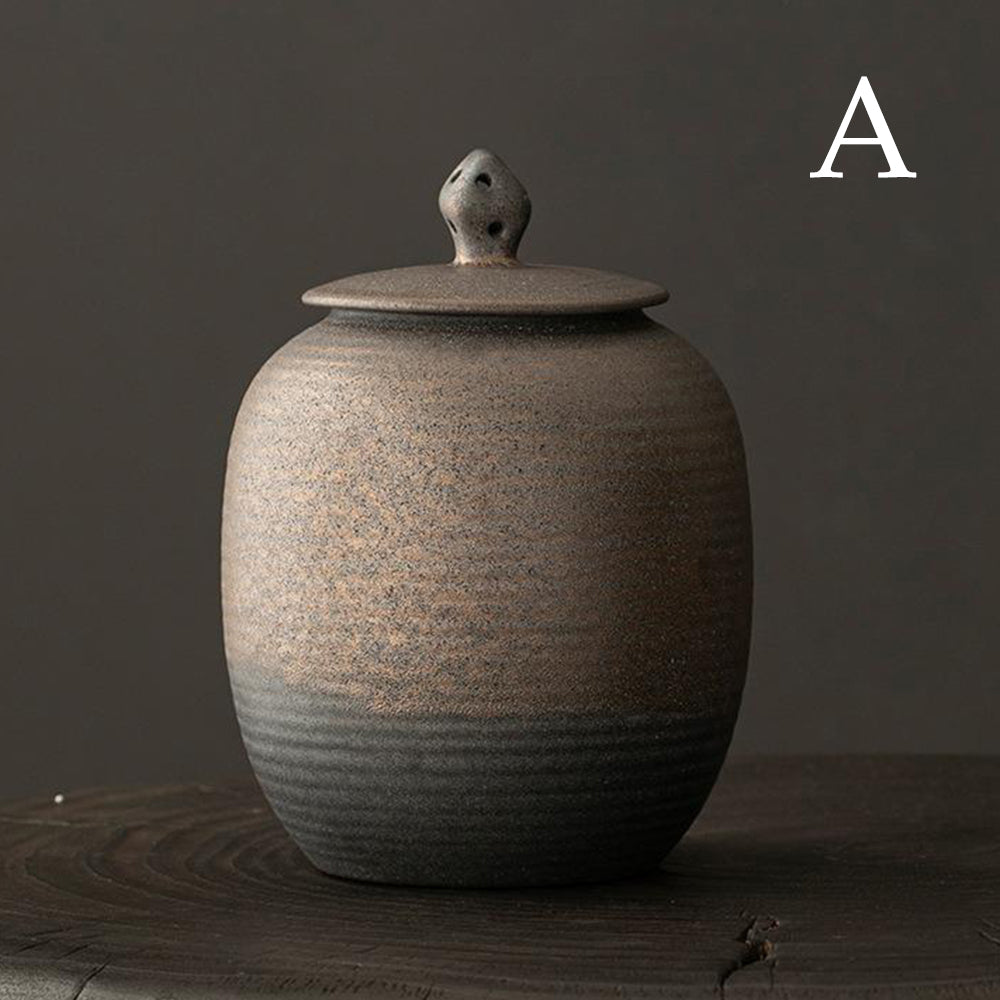 Elegant ceramic storage jar on a wooden table, filled with loose leaf tea, showcasing its functionality.