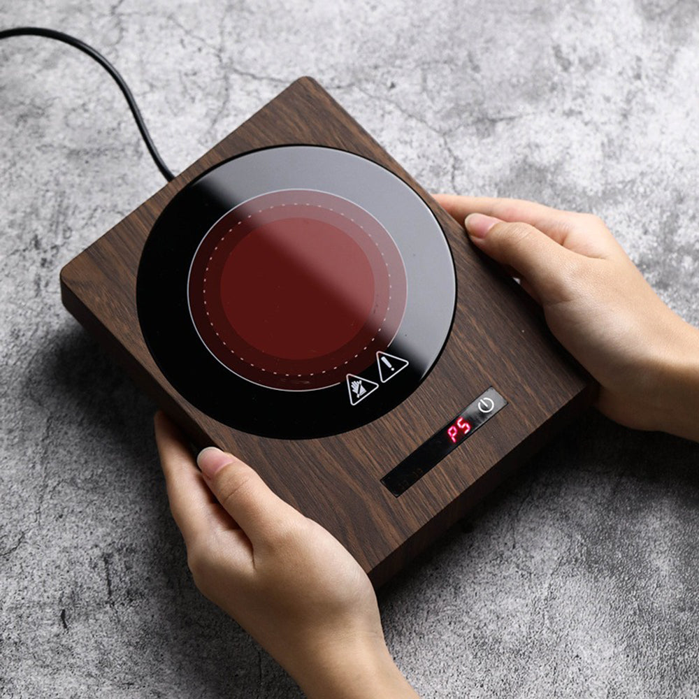 Side angle of coffee warmer with ceramic mug, highlighting compact design and timer function