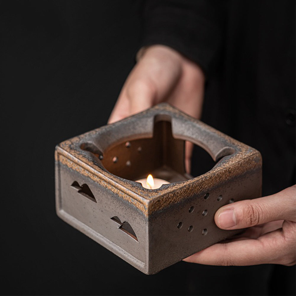 Close-up of the rustic glaze finish on the pottery teapot candle warmer