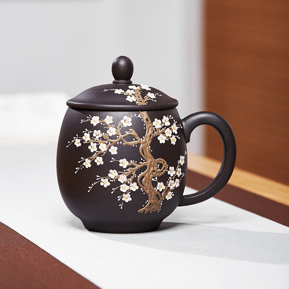 Close-up view of the color changing teacup showing the plum blossom pattern.