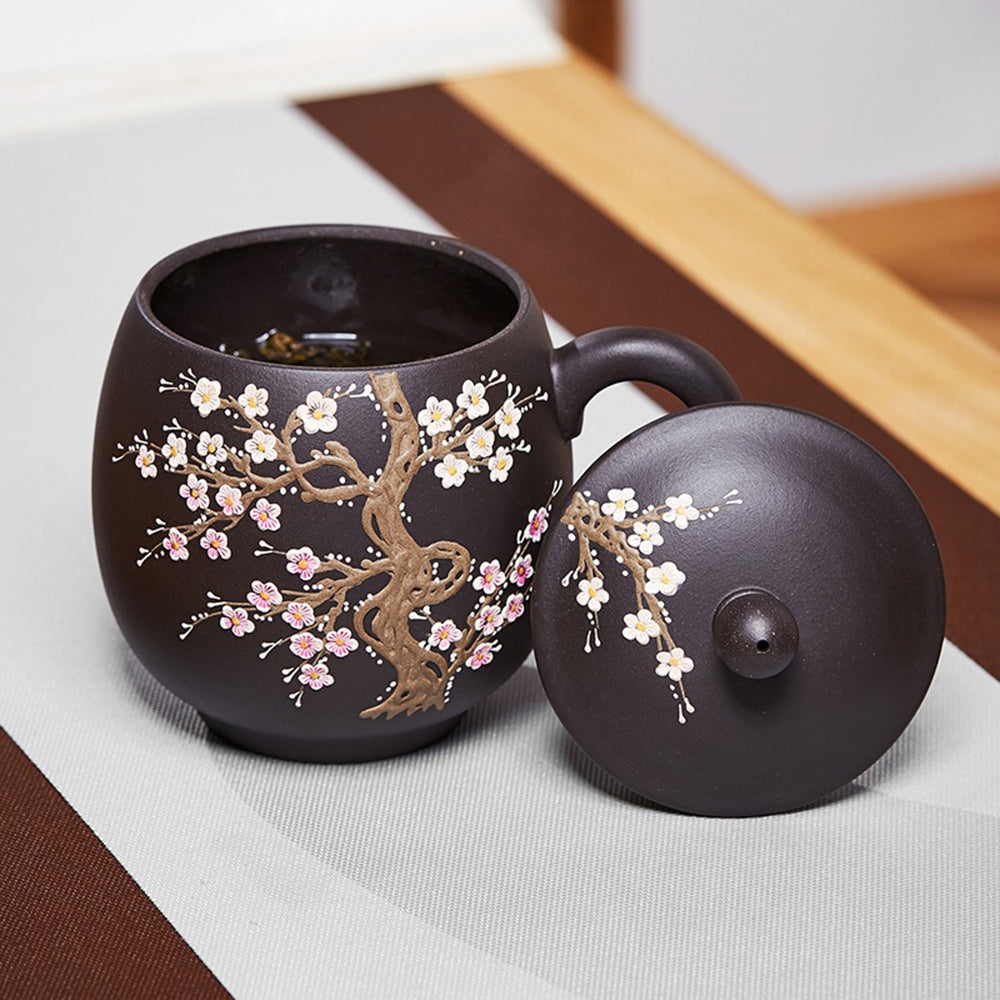 Side angle of the Yixing purple clay tea cup revealing the smooth rim and handle.