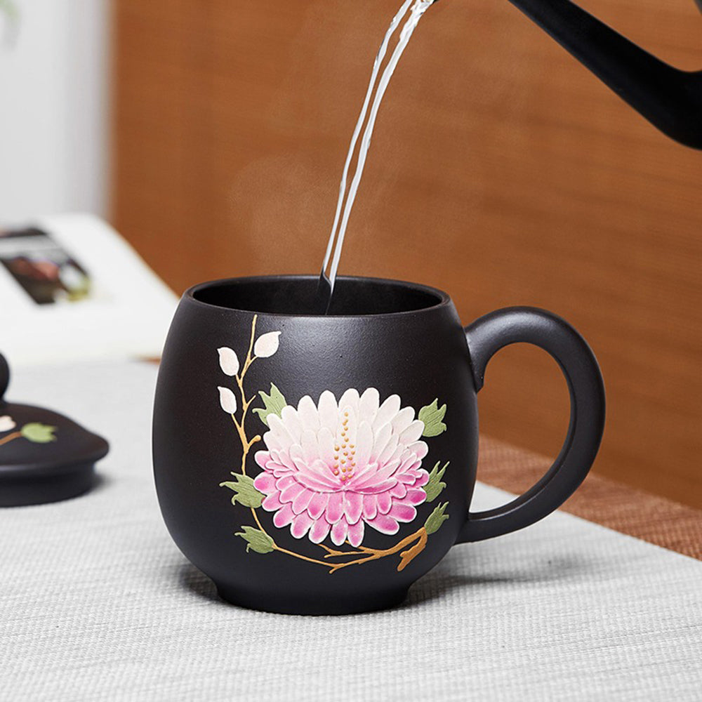 Side view of the purple clay teacup with hot tea, highlighting the vibrant pink peony flowers.