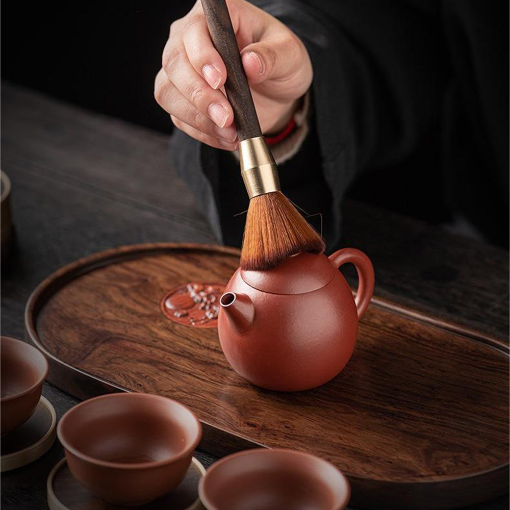 Luxury tea tools for Chinese tea making, including tea brush, knife, and cup fork, arranged beautifully