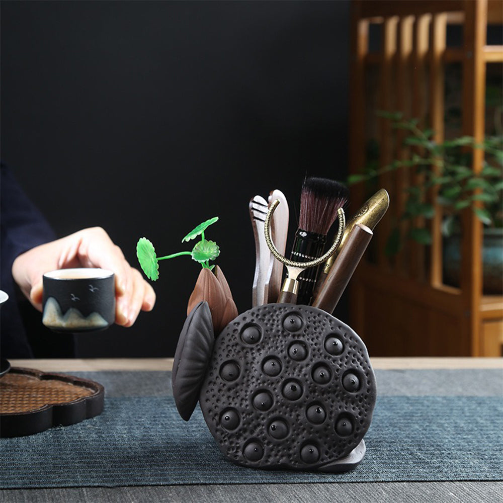 Close-up of the lotus pod holder showcasing its intricate carving in purple clay.