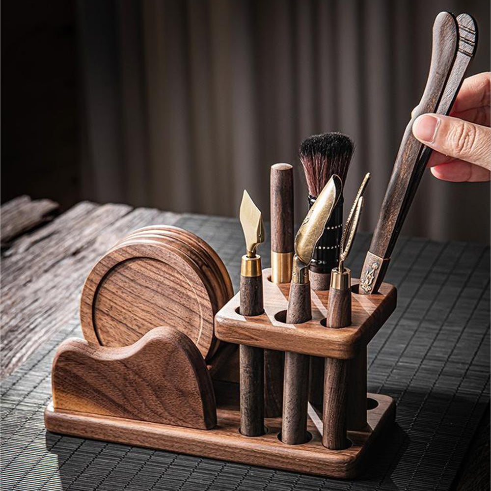 Handcrafted walnut tea utensils set with coasters on a wooden table, showcasing traditional kung fu tea tools
