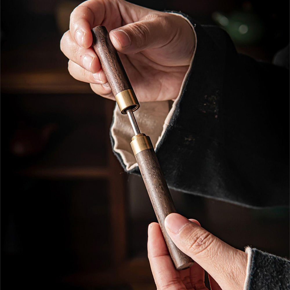 Handcrafted walnut tea utensils set with coasters on a wooden table, showcasing traditional kung fu tea tools