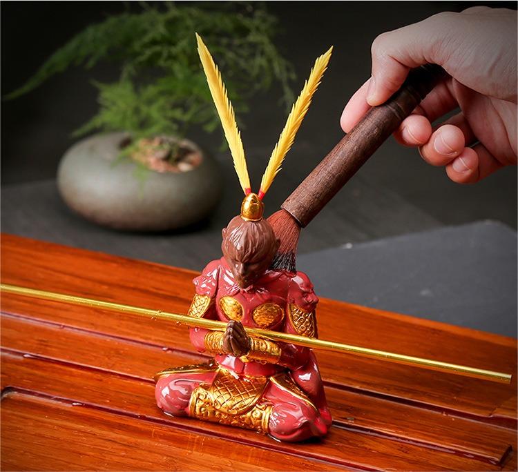 Wukong figurine displayed on a tea table, highlighting its role as a unique ceramic home decor piece