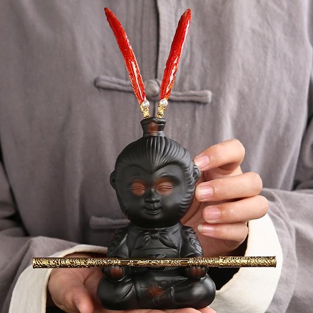 Charming Wukong purple pottery tea pet showcasing detailed craftsmanship.