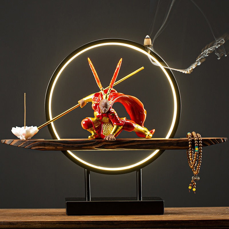 Wukong tea pet on LED light base with incense holder, showcasing intricate details.