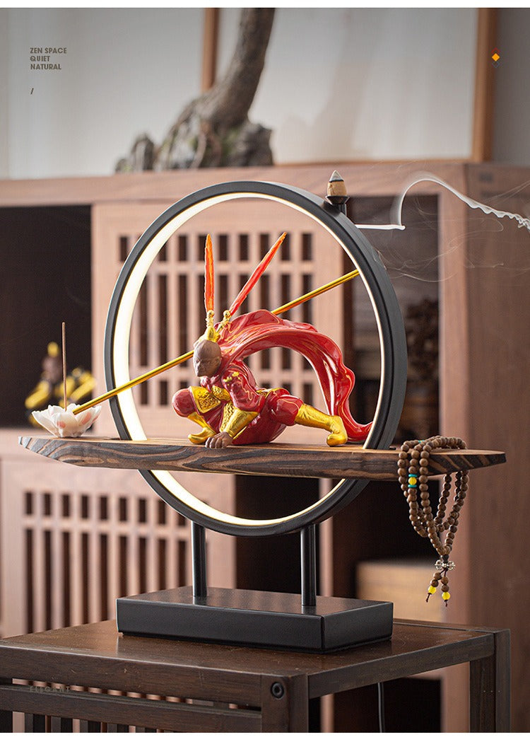 Wukong tea pet on LED light base with incense holder, showcasing intricate details.