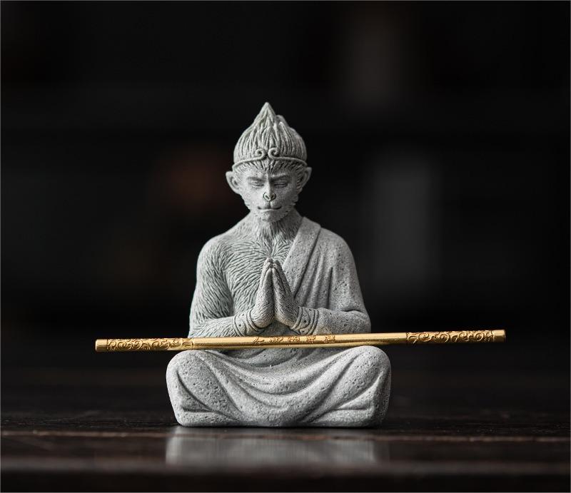 Wukong ornament placed on a tea table with traditional tea accessories