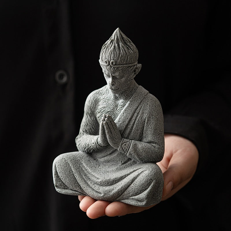 Close-up of Wukong stone tea pet showing detailed carving and sandstone texture
