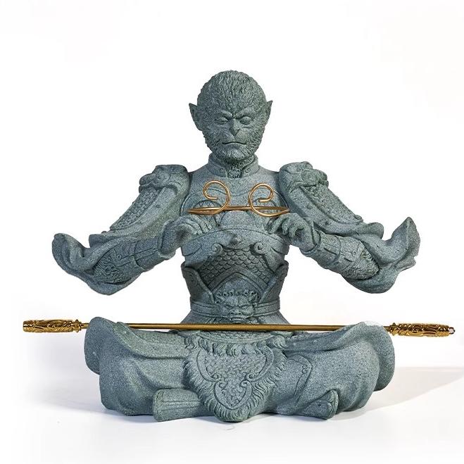 Front view of the Wukong sandstone tea pet showing detailed armor and detachable golden staff.