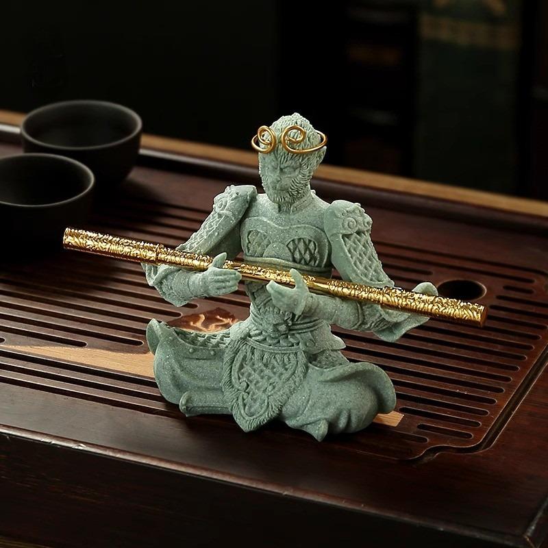 Close-up of the Wukong tea figurine’s facial expression and detachable accessories.