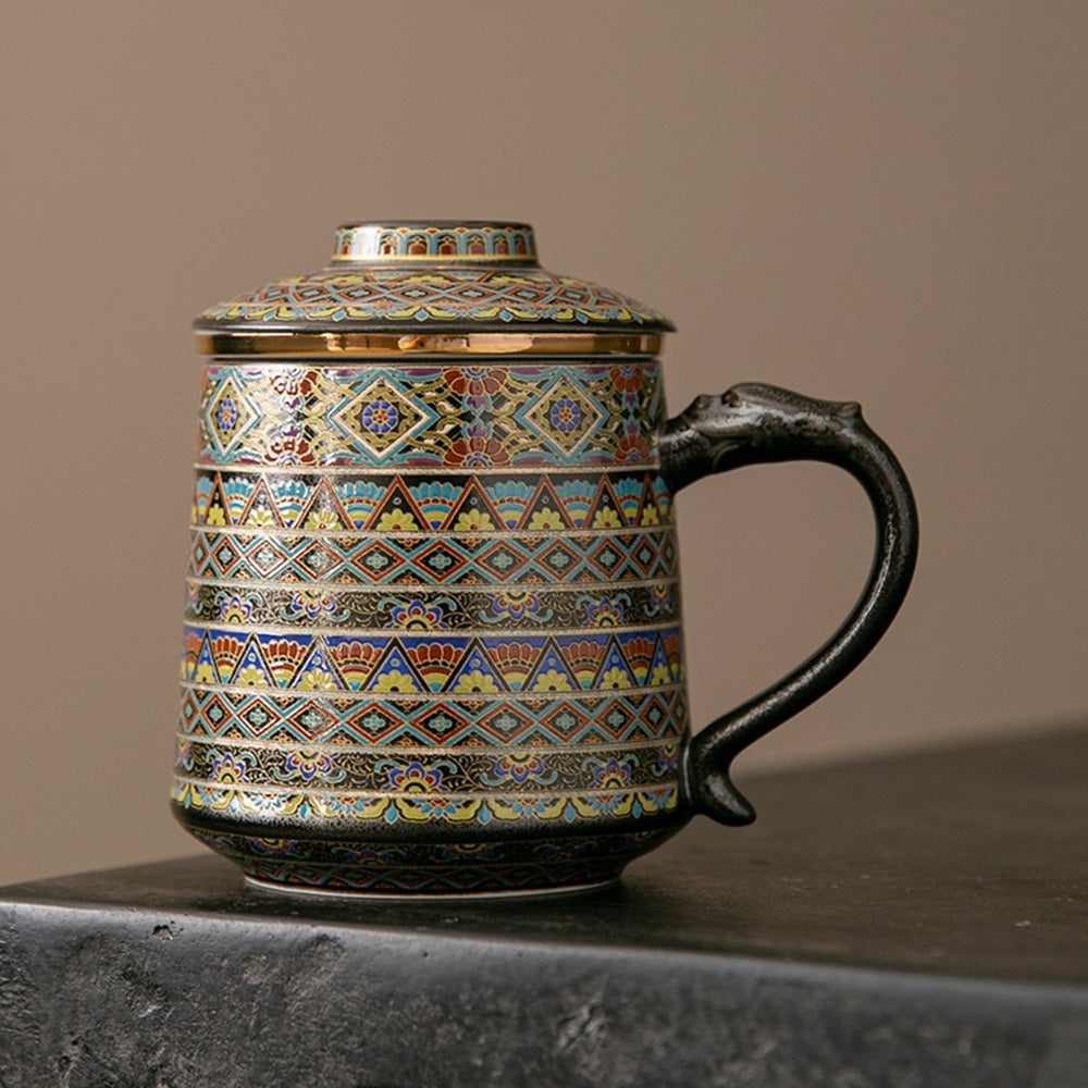 Front view of the ceramic mug showing dragon handle and strainer in place