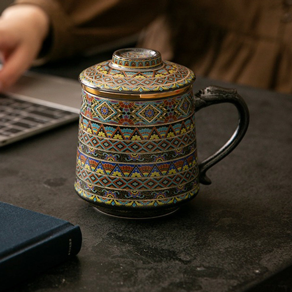 Front view of the ceramic mug showing dragon handle and strainer in place