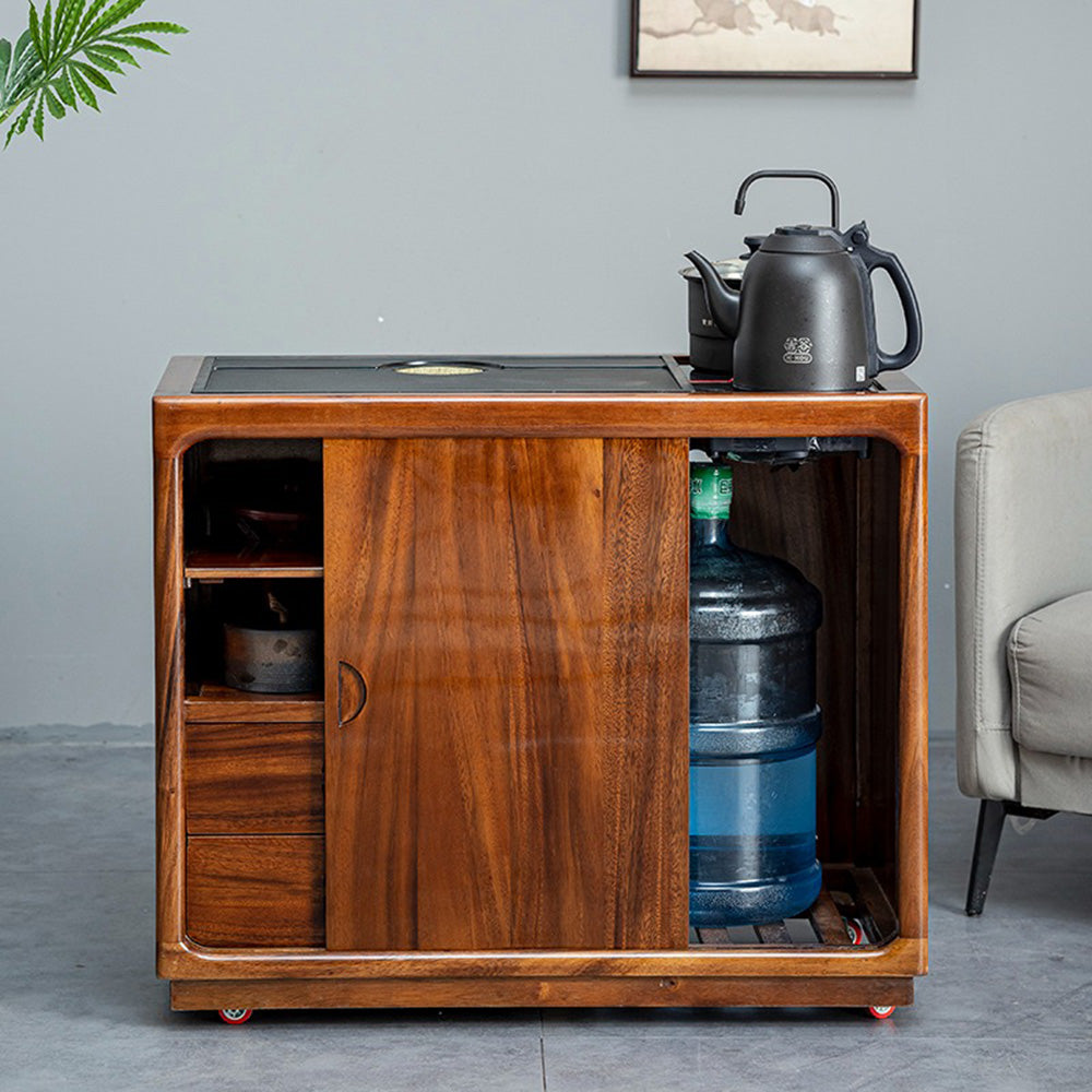 Close-up of the walnut tea tables intricate wood grain and durable black stone surface.