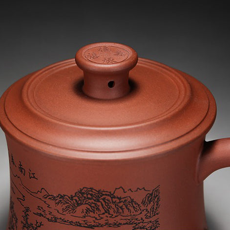 Tea brewing with an authentic purple clay cup in a cozy setting