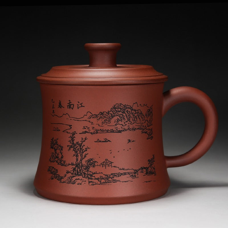 Side view of ceramic tea cup showing lid and handle