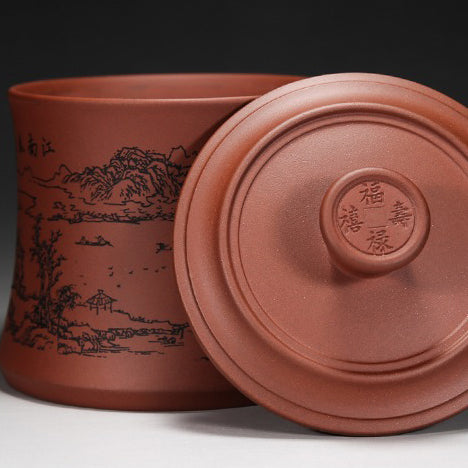 Yixing purple clay tea cup with traditional design and engravings
