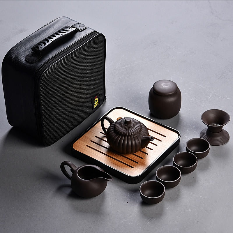 Yixing purple clay tea set placed on a wooden table, showcasing its elegant design.