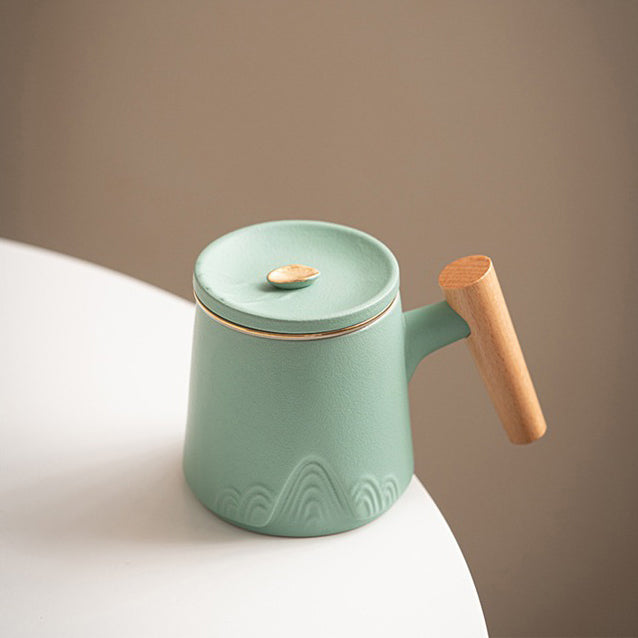 Close-up of traditional Japanese ceramic tea cup with wooden handle
